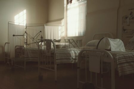 Rural Hospital Closures Accelerate as Medicaid Reimbursement Gaps Bite Small rural hospital building exterior in a remote community