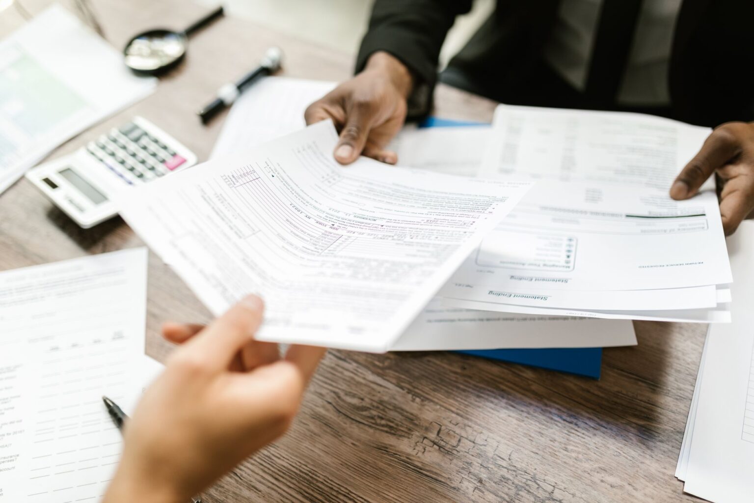 Child Tax Credit Phase-Out Cliffs Quietly Punish Middle-Income Families A family reviewing tax documents at a kitchen table