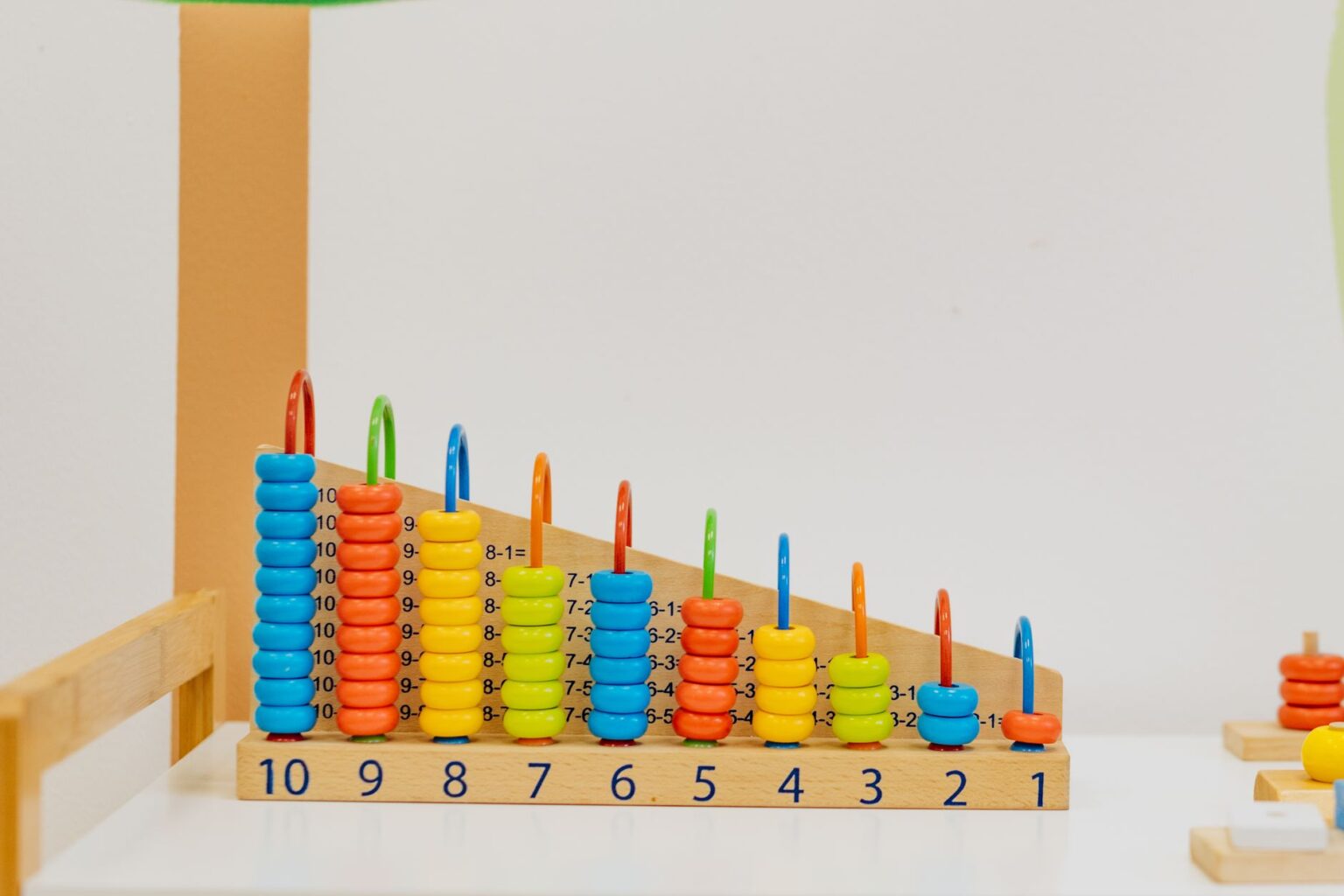 Childcare Worker Wage Stagnation Deepens Amid Sector Staffing Crisis Childcare workers supervising young children in a licensed daycare classroom setting
