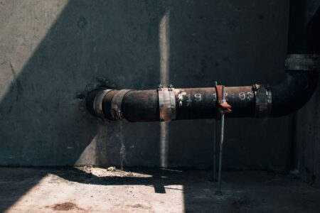 Water Utility Rate Hikes Accelerate as Infrastructure Debt Matures Aging underground water pipes exposed during infrastructure replacement work