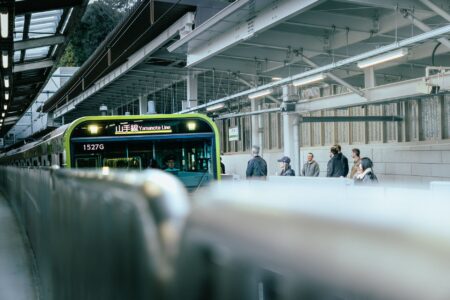 Commuters waiting on a busy urban subway platform during rush hour