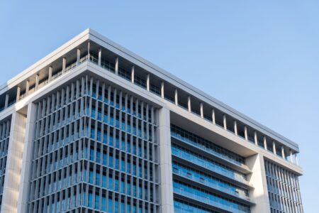 Corporate office building representing companies facing rising debt costs