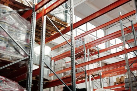 Warehouse Sublease Glut Signals Inventory Correction Far From Over Large empty warehouse interior with high ceilings and vacant storage space