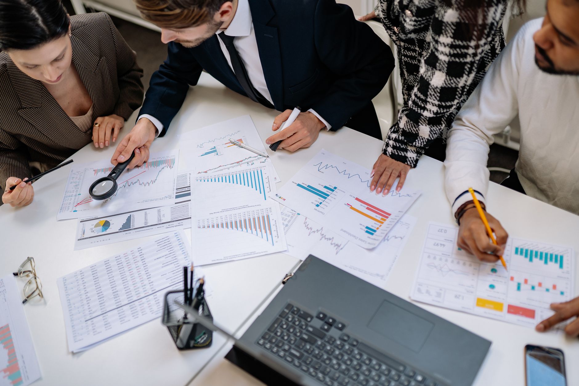 Business professionals reviewing financial documents in a budget planning meeting
