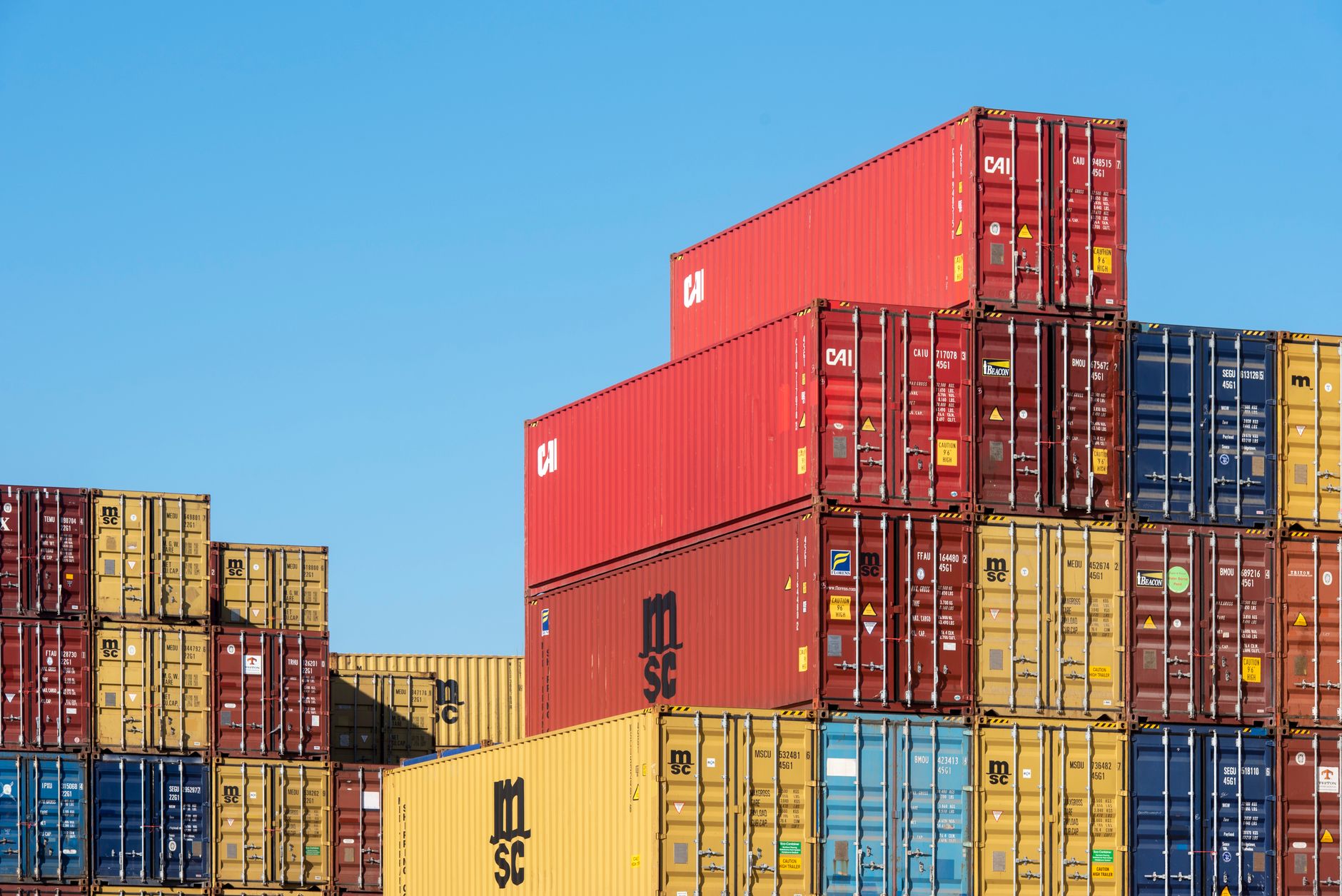 Logistics workers managing inventory in a distribution center amid shifting import demand patterns